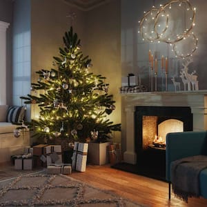 A living room with a Christmas tree and lights