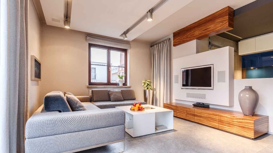 A living room with a drop ceiling