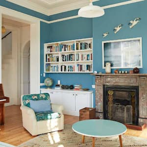 A living room painted in a light blue color