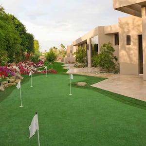 A luxury house with a backyard putting green