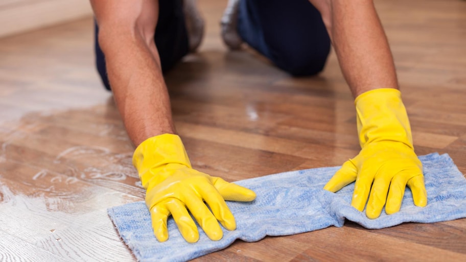 A man mopping floor