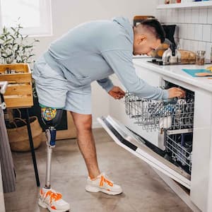 Man putting dishes in the dishwasher