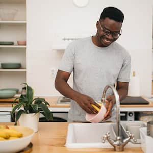 A man washing the dishes