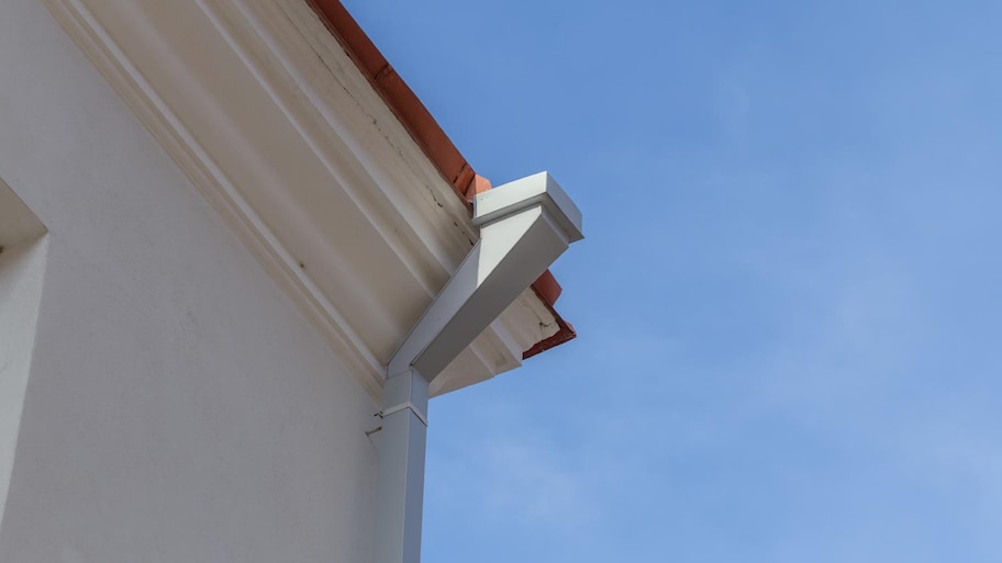 A metal roof gutter