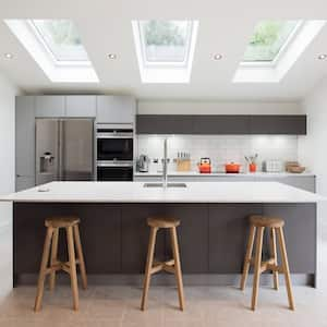 A modern kitchen with an island and a skylight