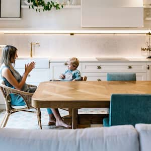 A mother and her son spending time together in the kitchen