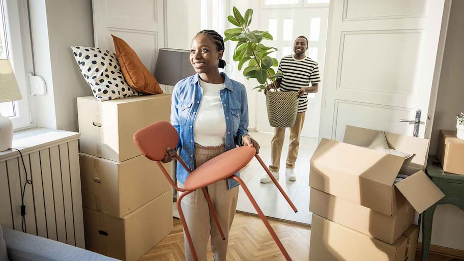 Young couple moving to their new home