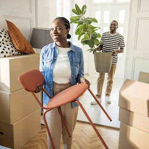 Young couple moving to their new home