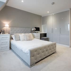 Bedroom with gray carpet and furniture