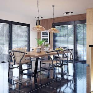 An open space living room with blinds on the windows