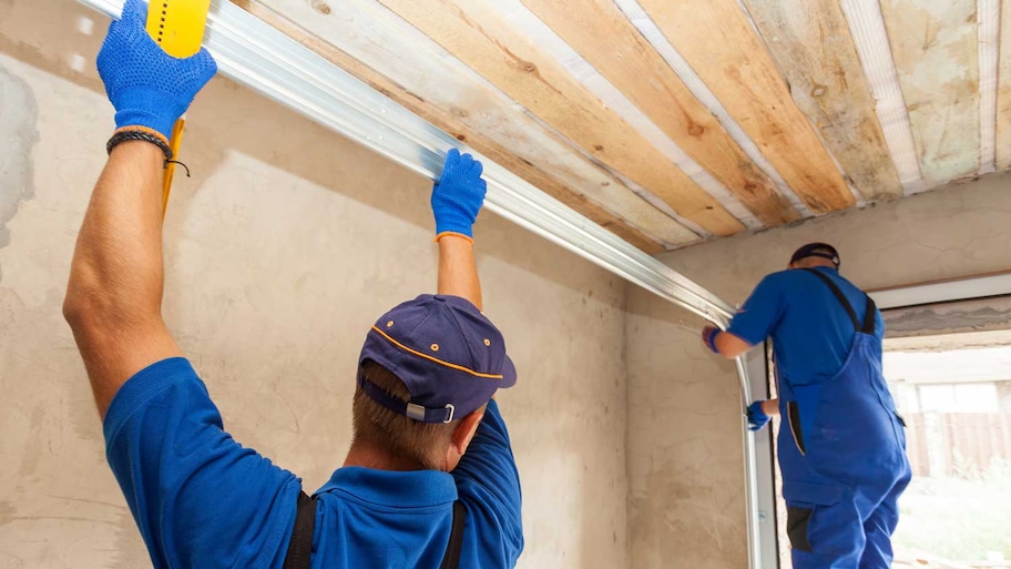 Professionals installing a garage door 