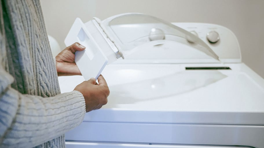 Woman holding dryer lint filter