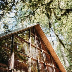 A rustic cabin with an a-type roof