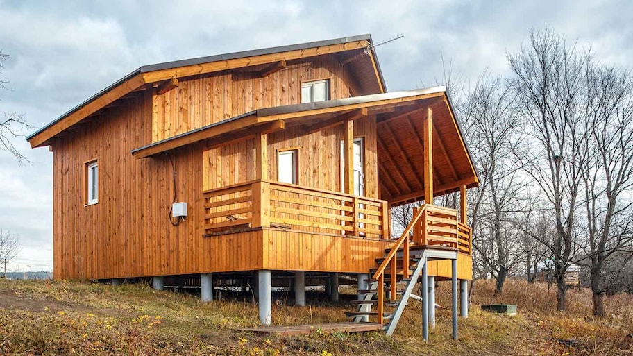 Scandinavian wooden house on a pier and beam foundation