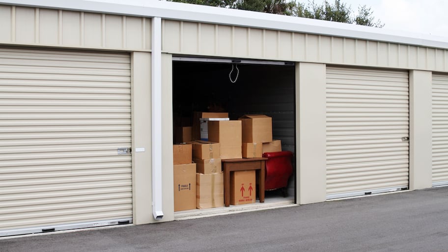 A self-storage unit filled with cardboard boxes