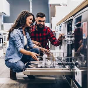 Couple shopping for kitchen appliances