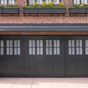 A side sliding garage door in a red brick house 