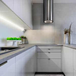 A small kitchen with concrete countertop