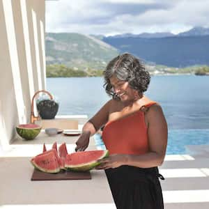 Smiling woman in her tropical home