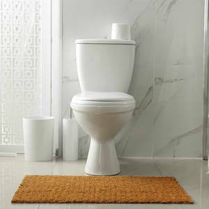 toilet in white marble bathroom