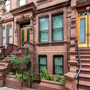 Staircases leading up to a brownstone building