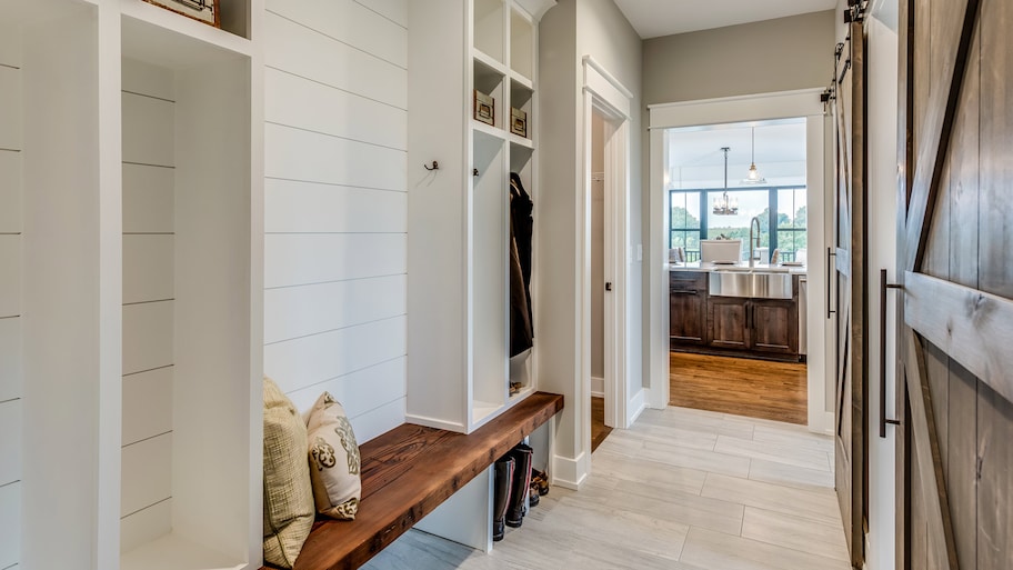 Entryway with wooden bench and vinyl planks for flooring