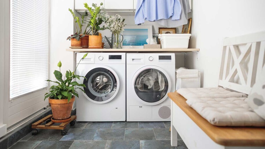 A washer and a dryer in a bright laundry room