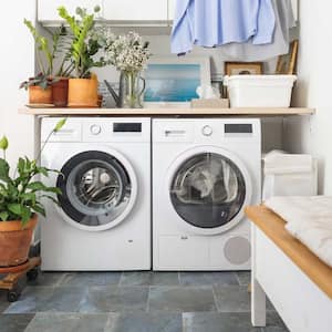 A washer and a dryer in a bright laundry room