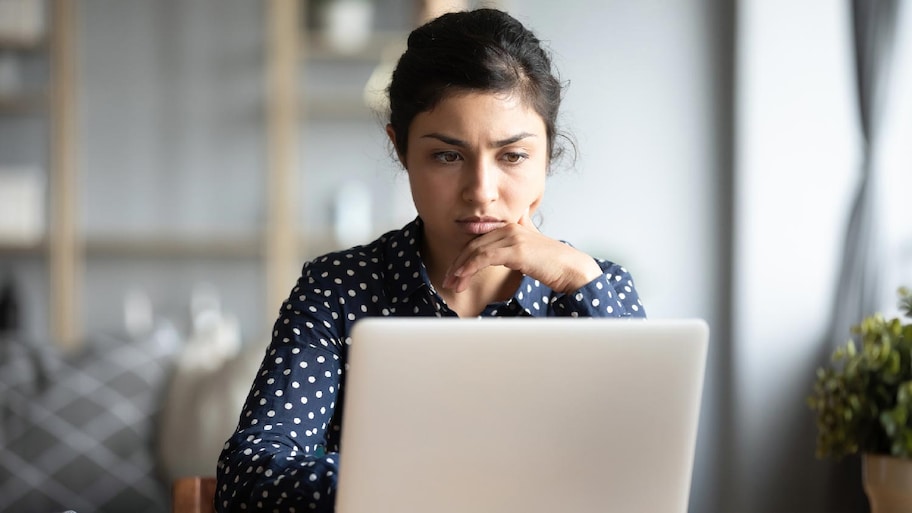 A woman checking reviews on her laptop