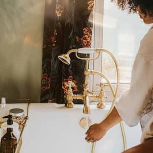 A woman checking the temperature of bath