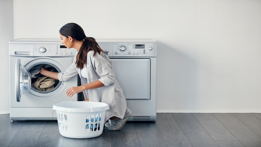 A woman doing her laundry at home