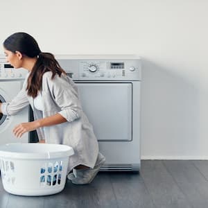 A woman doing her laundry at home