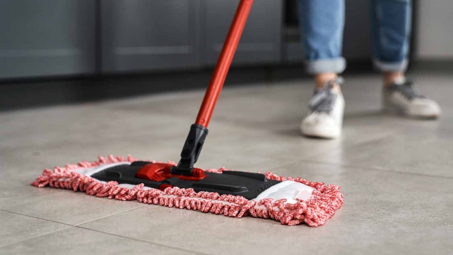 woman mopping the floor at home 