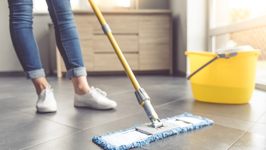 woman mopping tile floor