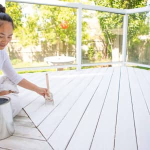 Woman painting deck