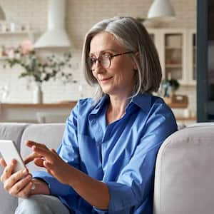 older woman looking at her phone