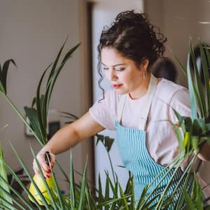 A woman taking care of her plants