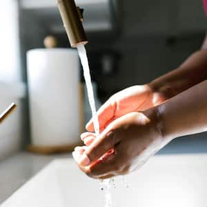 A woman washing her hands