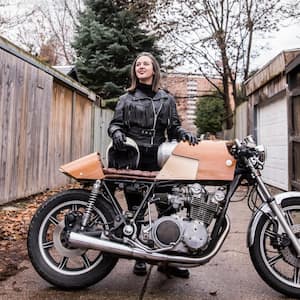 A woman with her motorcycle