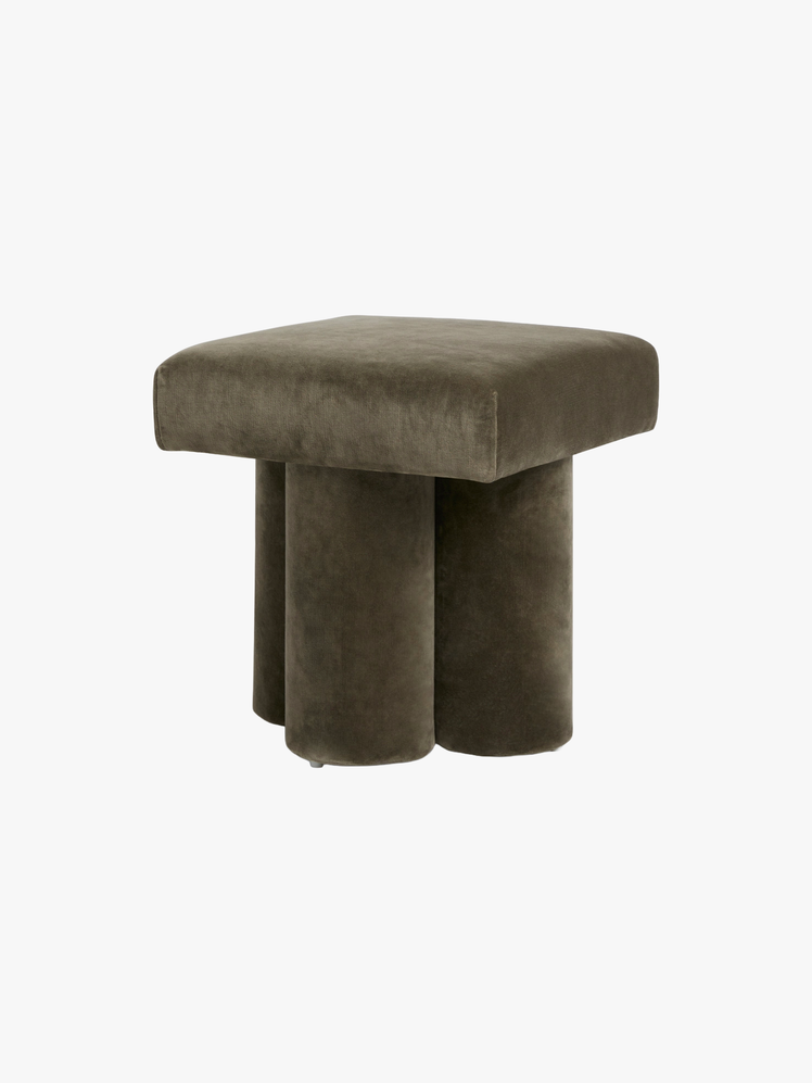 Stool with a square top and cylindrical legs all upholstered in olive green velvet.