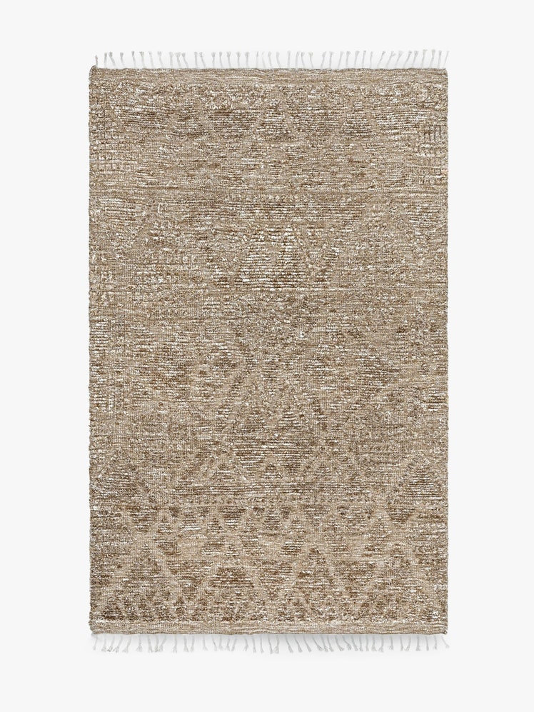 Hand Knotted Wool Rug with tassels on ends.