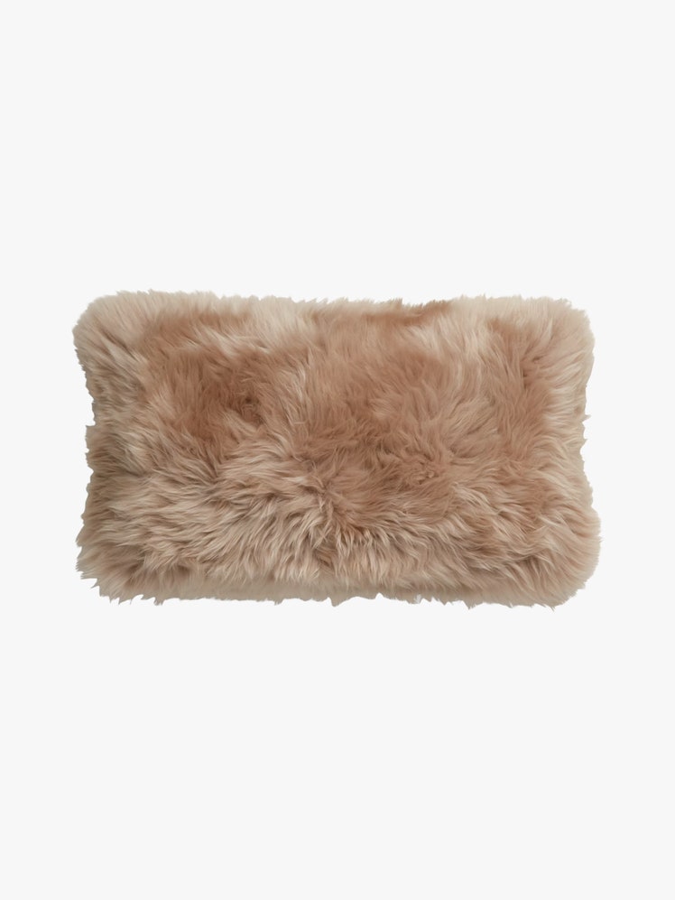 Sheepskin Lumbar Throw Pillow in a blush color.