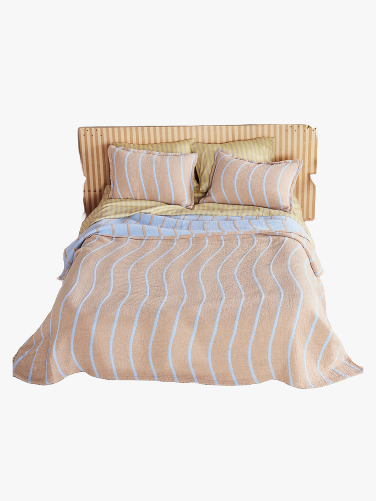 Image may contain Cushion Home Decor Furniture Pillow Bed and Bed Sheet