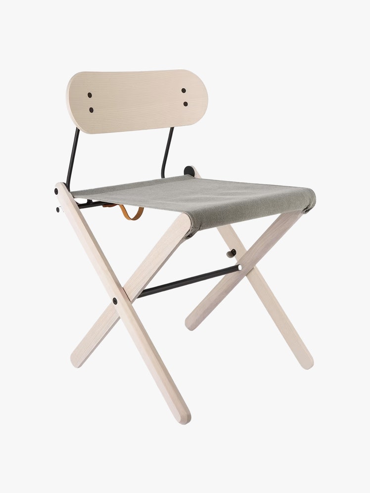 Folding wood chair with a canvas seat.