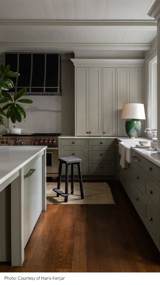 Kitchen designed by Sean Anderson with light green cabinetry.