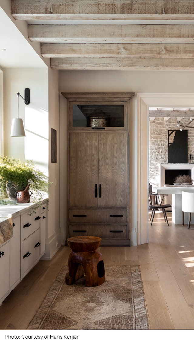 Kitchen of a home in Birminham designed by Sean Anderson featuring whitewashed exposed beams in the ceiling a cabinet in...