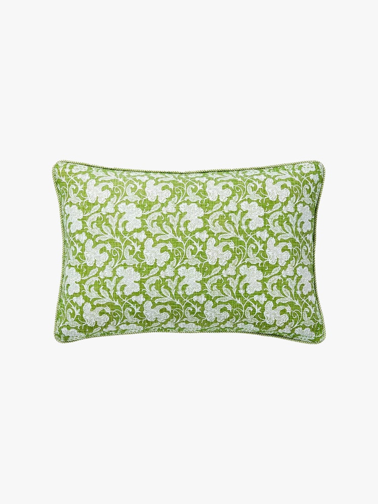 Rectangular pillow with a green botanic block print and matching cord piping.