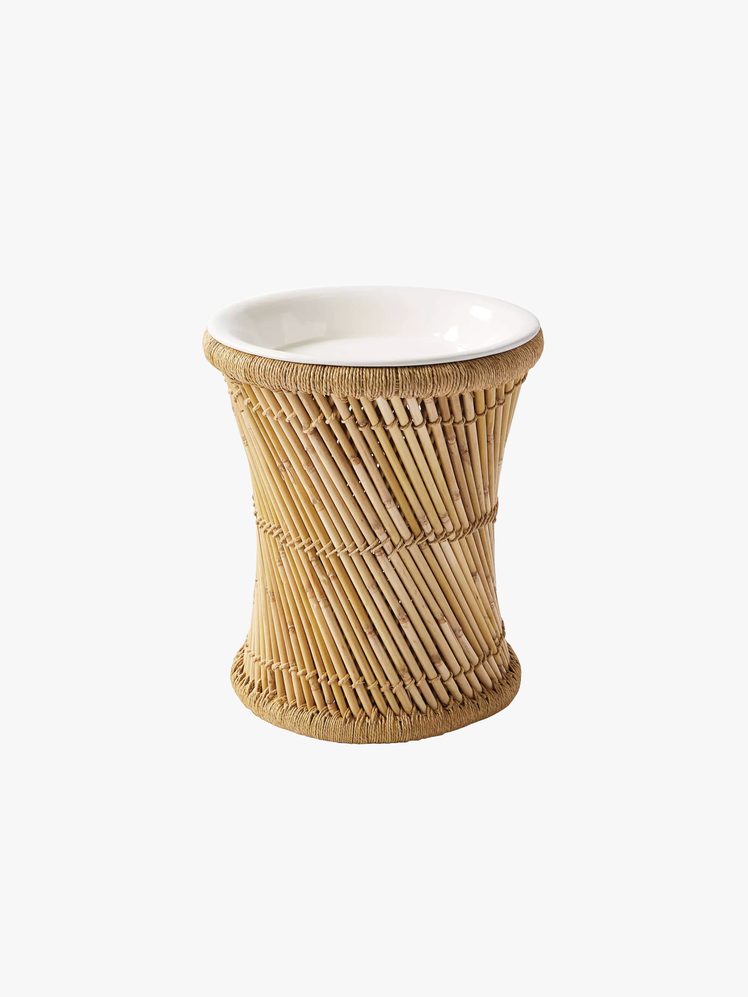 Side table made of bamboo poles handwrapped in jute. Secret storage topped with a white enamel tray.