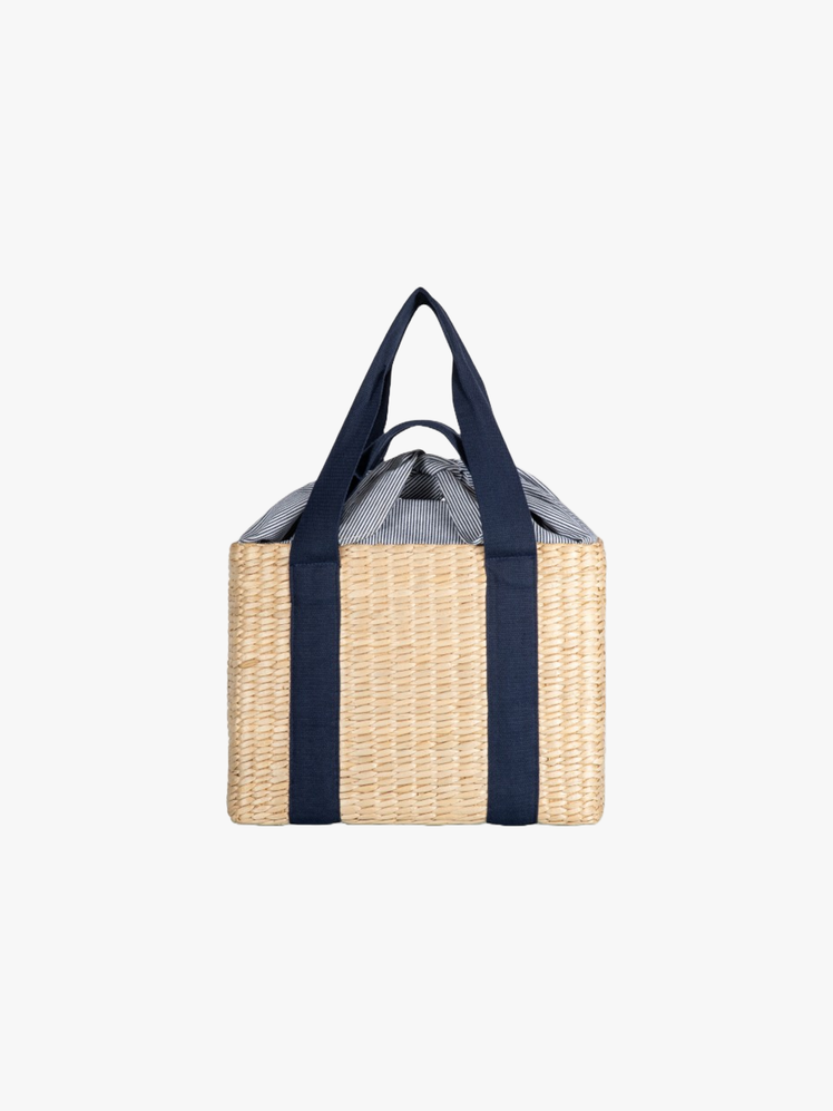 Woven seagrass basket with loose fabric tie closure and two sets of carrying straps.