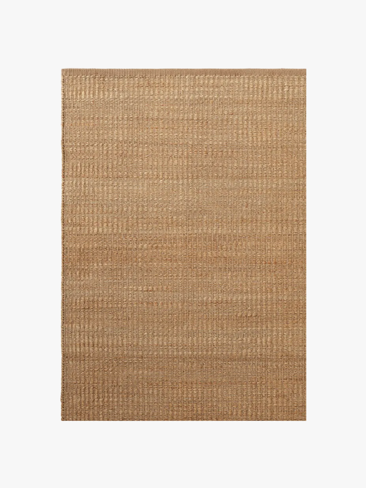 Rectangular rug made from a blend of hand and millspun jute with subtle wool weft woven into vertical lines.